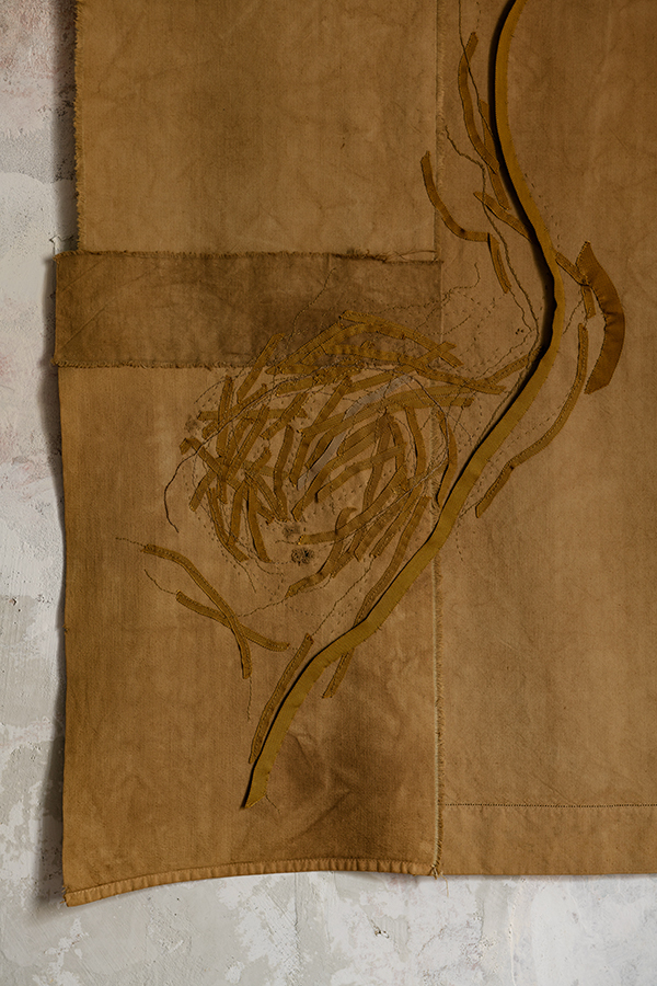 detail of vegetal dyed abstract hand embroidered wall hanging